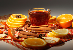 Чашка, апельсины, корица, чай